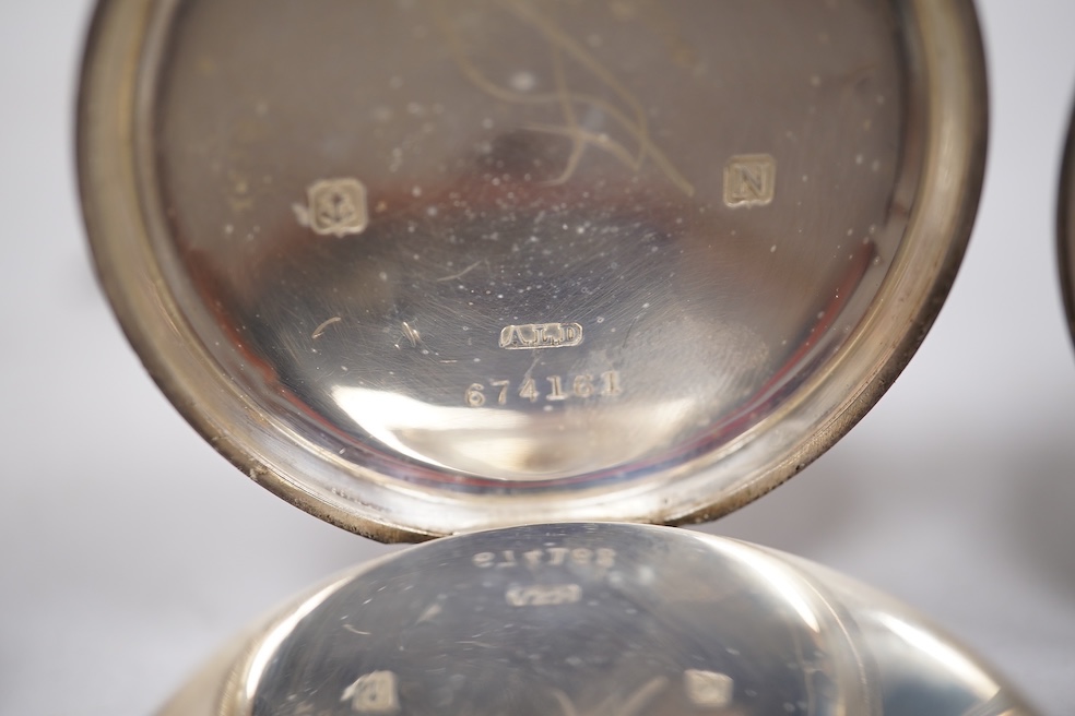 Three early to mid 20th century silver open faced pocket watches, with Roman or Arabic dials and subsidiary seconds, including two keyless and one key wind (Admiral Tacy Watch Co), together with one smaller silver open f